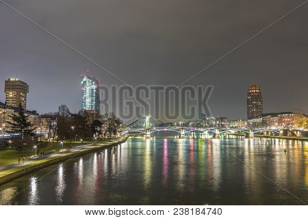 Skyline Of Frankfurt By Night With River Main