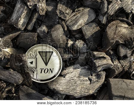 Silver Coin Of Con Lies On Coal. Mining Cons.