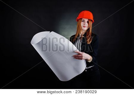 Engineer Woman In Orange Protect Helmet With Construction Paper Projekt.