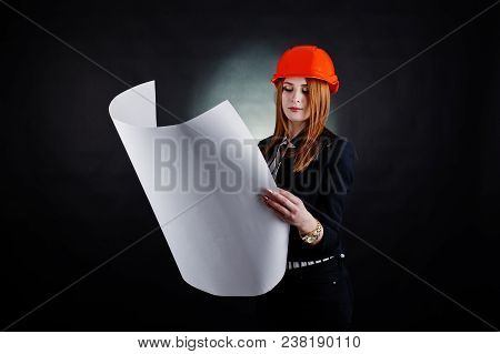 Engineer Woman In Orange Protect Helmet With Construction Paper Projekt.