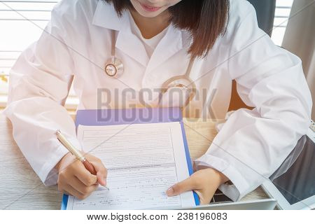 Healthcare Medical Concept. Woman Doctor Writing Prescription Clipboard With Record Information Pape