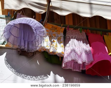 Skirts On String. Drying Clothes Ladies Skirts On The String On The Balcony