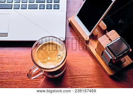 Communication Set With Smart Watch, Tablet Pc, Computer And A Cup Of Coffee On A Table.