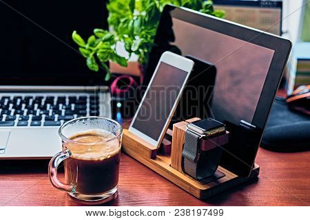 Communication Set With Smart Watch, Tablet Pc, Computer And A Cup Of Coffee On A Table.