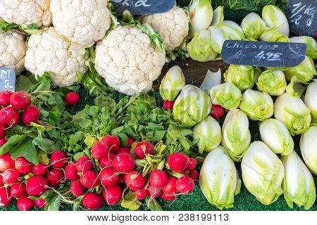 Radish, Cauliflower And Chicory For Sale At A Market