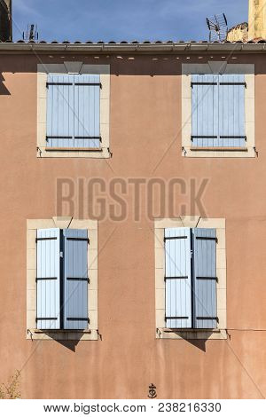 Traditional French Window With Wooden Shutters At An Old House In Provence Orange Color