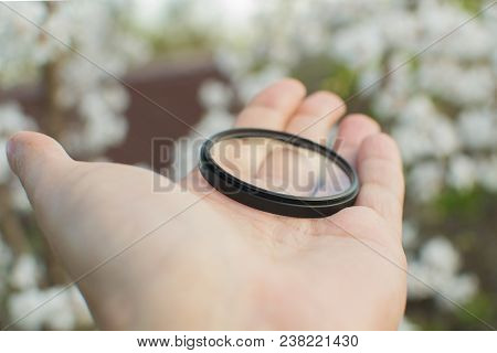 Protective Filter For The Lens Photographer Is Holding A Uv Filter