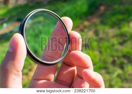 Protective Filter For The Lens Photographer Is Holding A Uv Filter