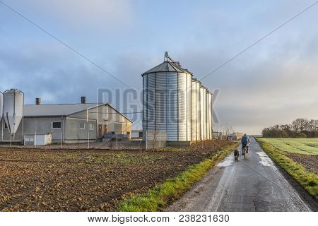 Silo In Beautiful Landscape With Dramatical Light Placed In Plouged Acres