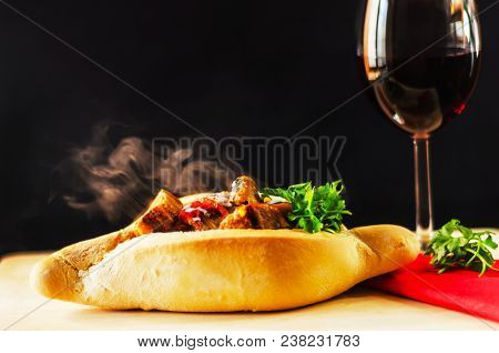 Goulash With Large Pieces Of Meat And Vegetables, All Served In Bread, Attractive And Satiating Meal