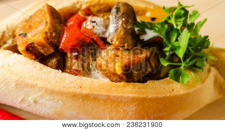 Goulash With Large Pieces Of Meat And Vegetables, All Served In Bread