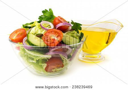Vegetable Salad In Glass Plate And Sunflower Oil On A White Background, Close Up.