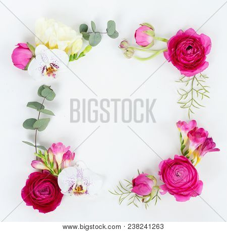 Flowers Composition. Frame Made Of Eucaliptus Leaves And Flowers On White Background. Flat Lay, Top 