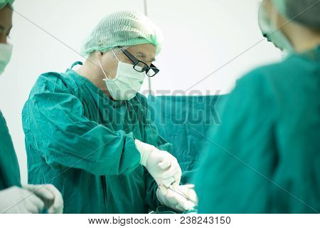 The Surgery Team Working Together At The Operating Room In The Hospital.