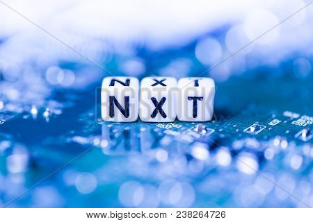 Word Nxt Formed By Alphabet Blocks On Mother Cryptocurrency Closeup