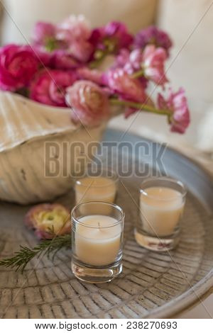Round Metal Rustic Tabletop With Pink Ranunculus In Seashell Shaped Vase, Carcade Tea In A White Cup