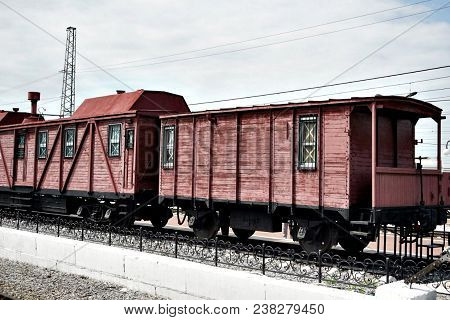 Old Red Railway Freight Wagon Is On The Rails