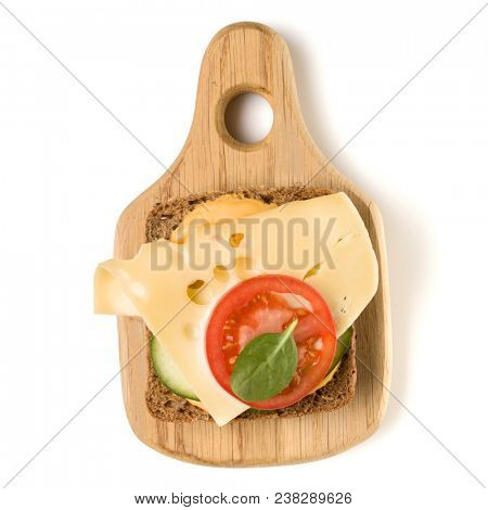 Open  faced cheese sandwich canape or crostini on a wooden serving board  isolated on white background closeup. Top view. Vegetarian tartarine.