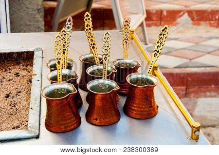 Cezve And Cups Ready For Preparing Turkish Coffee On The Sand