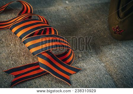 Military Cap With Order Of Great Patriotic War And Tulips Flowers Tied By Saint George Ribbon In Hon