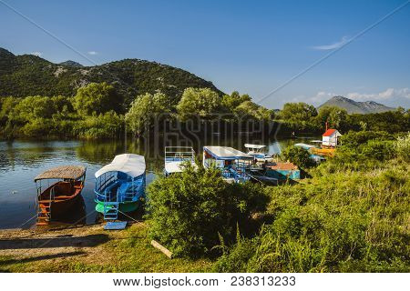 June, 8th, 2016 - Skadar Lake, Montenegro. Fishing Boats, Mountains And Shore Houses On Tsrnoyevicha