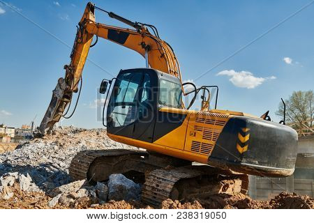 secondary demolition by excavator with hydraulic hydrohammer breaker