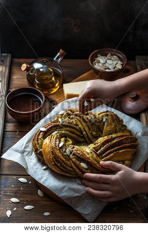 Small Boy Put Pumpkin Seeds On Babka Brioche Wreath.