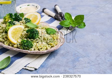 Traditional Pasta Tripoline With Pesto And Broccoli In A Plate On The Table. Selective Focus.