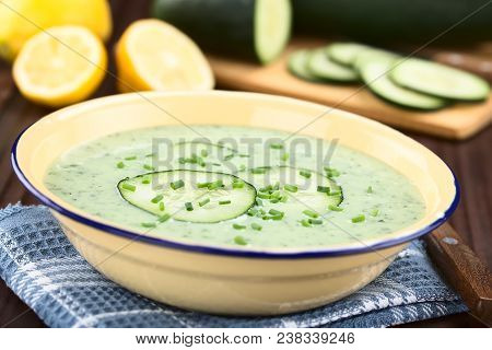 Refreshing Cold Cucumber, Yogurt, Mint And Lemon Soup In Enamel Bowl, Garnished With Cucumber Slices