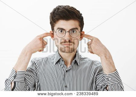 My Mind Blows From Your Talks. Portrait Of Annoyed Fed Up Caucasian Guy In Glasses, Holding Breath A