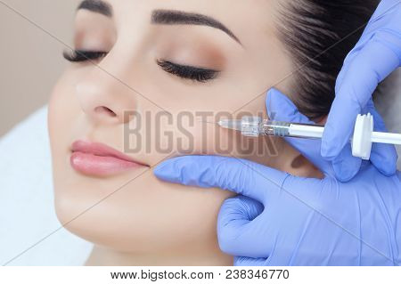 The Doctor Cosmetologist Makes The Rejuvenating Facial Injections Procedure For Tightening And Smoot