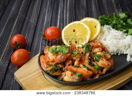 Roasted Shrimps With Lemon, Garlic,herbs And White Rise, Seafood Shelfish Shrimps Prawns Grilled Wit