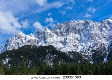 View to the Great snowcapped Mountains of the Bavarian Alps in Germany.
Close-up of the beautiful white Mountains of the bavarian Alps on a sunny Day.
Mountain ans Nature Backgrounds.