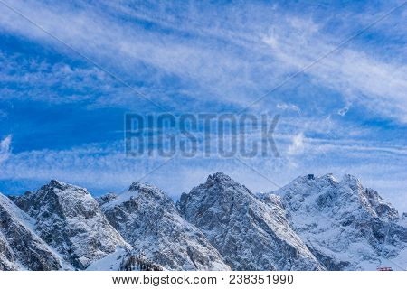 View to the Great snowcapped Mountains of the Bavarian Alps in Germany.
Close-up of the beautiful white Mountains of the bavarian Alps on a sunny Day.
Mountain ans Nature Backgrounds.