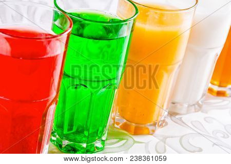 Different Soft Drinks In A Glass. Close Up