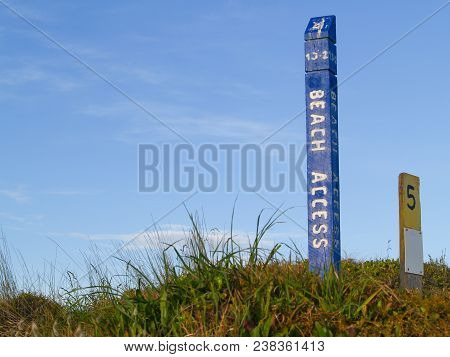 Blue Beach Access Sign On Papamoa Dunes.