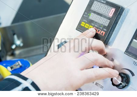 A Close-up Of The Operator The Man Presses The Button On The Control Panel With The Control Devices 