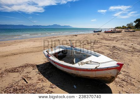 Lonely Fisherboat At The Coast Of Kavos In Corfu, Greece