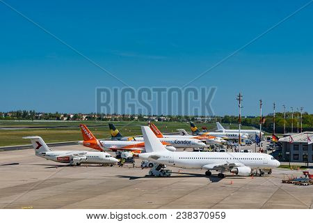 Berlin Germany - April 21. 2018: Airplanes At The Terminal At Berlin Tegel Airport