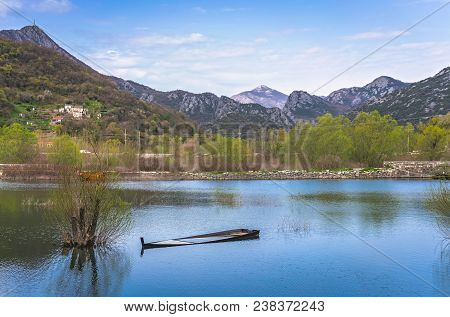 Old Sunken Wooden Fisherman Boat On The Shore Of Lake Skadar In Virpazar, Montenegro