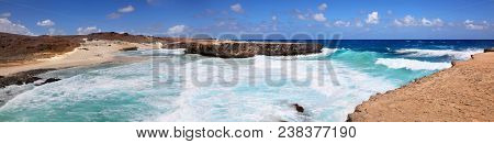 Panoramic View Of The Dramatic Crashing Turquoise Waves On Boca Ketu Beach In Aruba