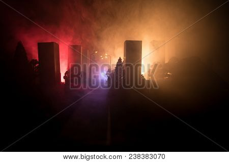Empty Street Of Burnt Up City, Flames On The Ground And Blasts With Smoke In The Distance. Apocalypt