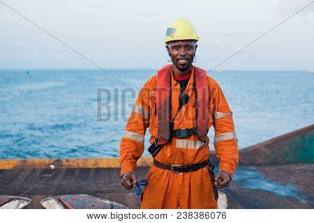 Seaman Ab Or Bosun On Deck Of Offshore Vessel Or Ship , Wearing Ppe Personal Protective Equipment - 