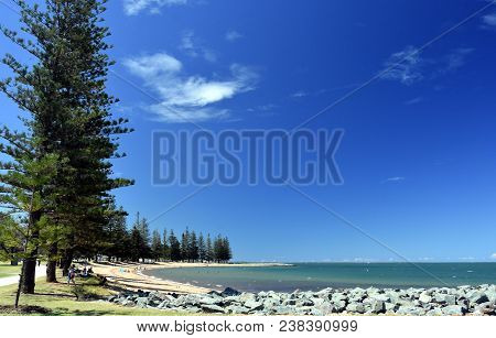 Scarborough Beach On A Sunny Day At Christmas Time (redcliffe, Qld, Australia). Trees Around The Bea
