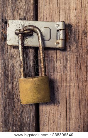 Old Lock On The Door. Lock On The Door Of An Old Farmhouse . True Village Style . Close-up. Focus On