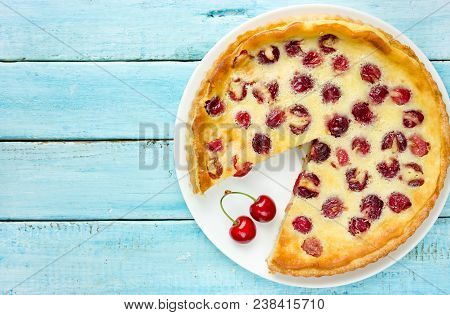 French Dessert Cherry Clafoutis On Blue Wooden Table Top View