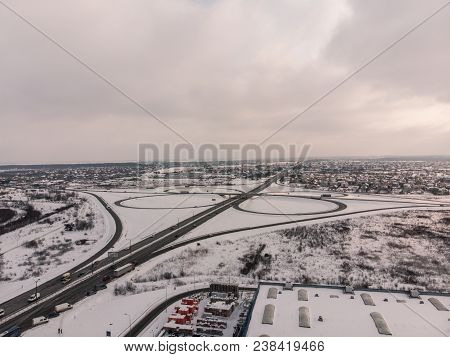 Highway Aerial View. Car Travel Concept. Winter Overcast Weather