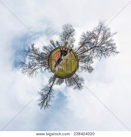Green Little Tiny Planet With Trees Near Gateway Lock Sluice Construction On River, White Clouds And
