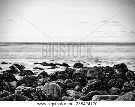 Rocky Coast Of Sea. Slow Shutter Speed For Smooth Water Level. Visite Talisker Bay On The Isle Of Sk