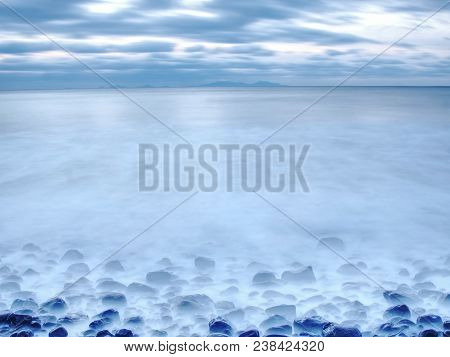Rocky Coast Of Sea. Slow Shutter Speed For Smooth Water Level. Visite Talisker Bay On The Isle Of Sk